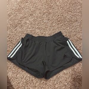 Green athletic adidas shorts